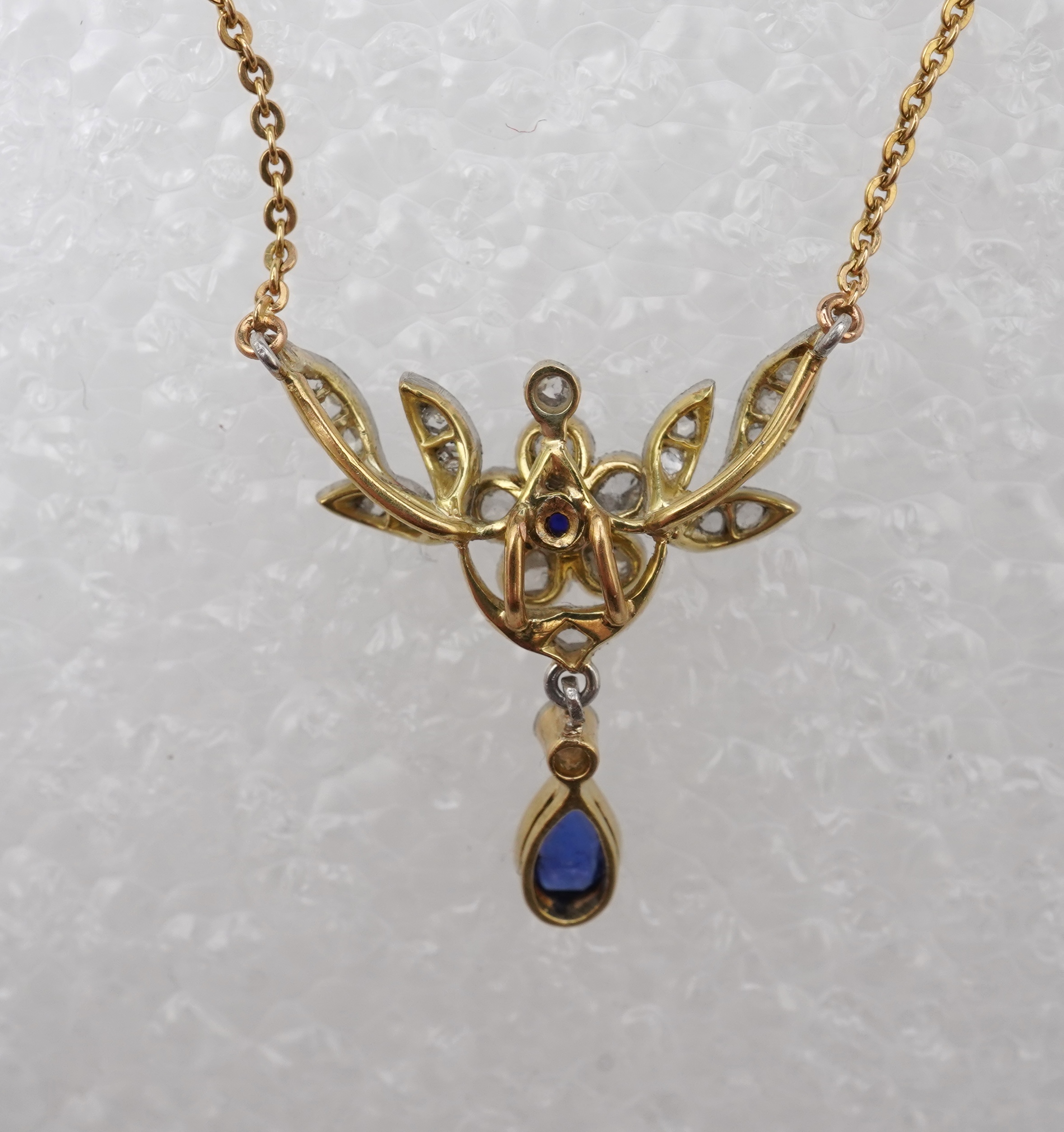 A sapphire and diamond pendant